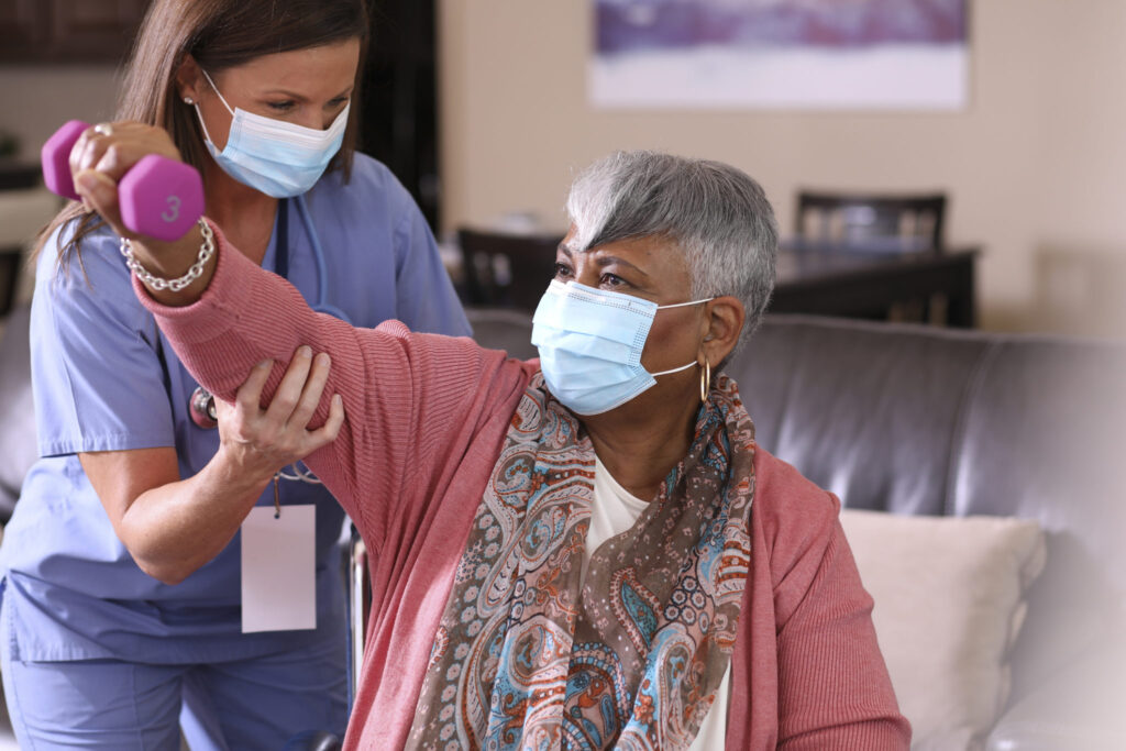 Senior adult woman and home health care nurse.
