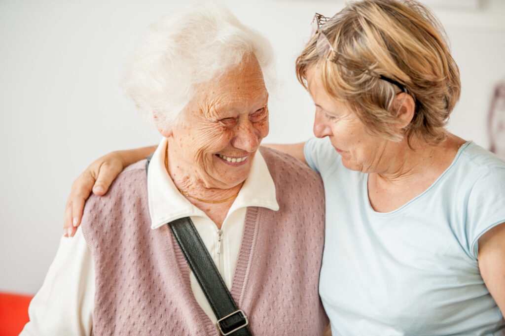 Tenderness Between Senior Mother And Mature Daughter