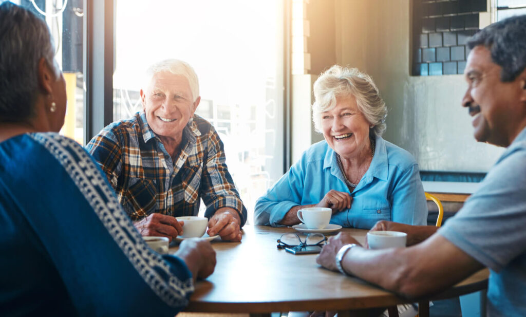 Senior-people-and-group-relax-on-holiday-at-cafe-on-vacation-in-retirement Senior, people and group relax on holiday at cafe on vacation in retirement|Elderly Woman staring at a yellow note
