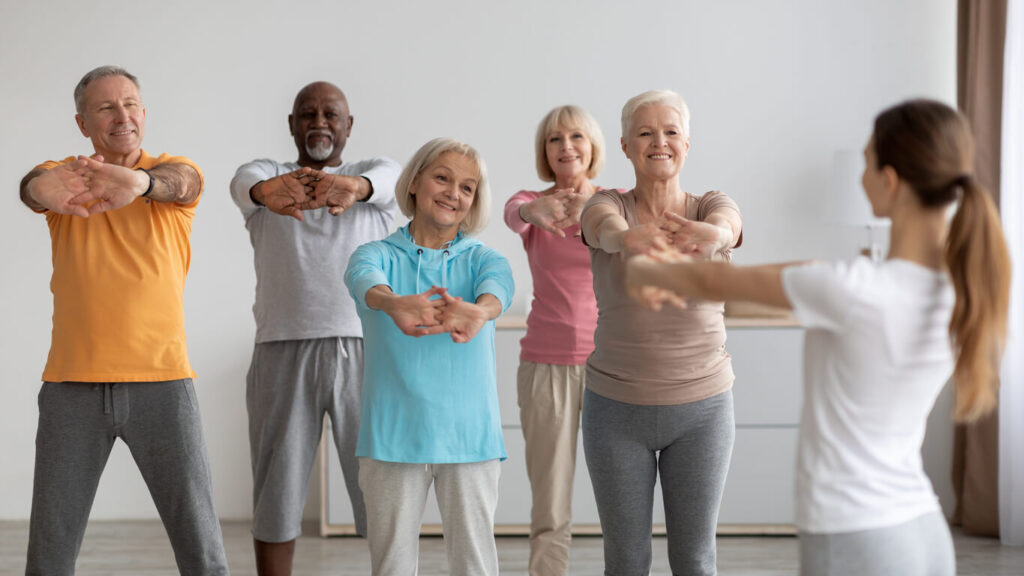 Sporty-elderly-people-having-fitness-class-training-with-instructor Sporty elderly people having fitness class, training with instructor|Cheerful active senior couple jogging in the park