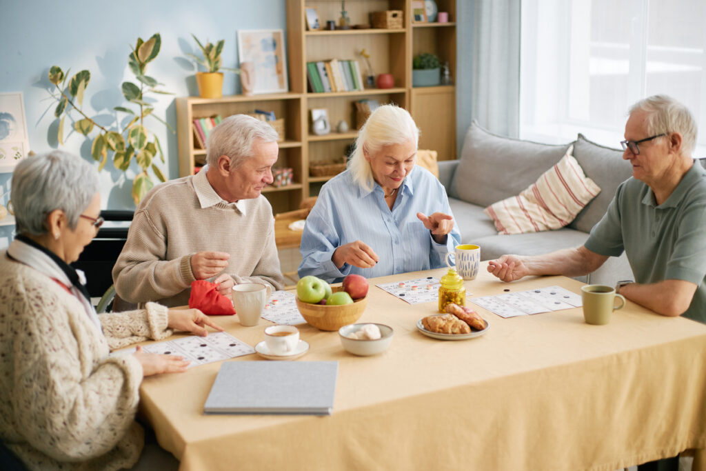 Visiting-a-Loved-One-in-a-Senior-Living Group of Elderly People Enjoying Breakfast Together